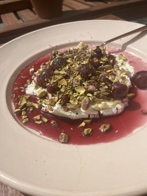 FENNEL AND FIG LEAF CHERRIES, WITH LABNEH, HONEY & TOASTED PISTACHIOS.