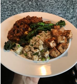 Lentil & Black bean Chilli with Petit Pois Rice, Sautéed Tender stem Broccoli, baby corn & Peri Peri Tofu